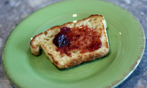 English muffin bread with strawberry jam