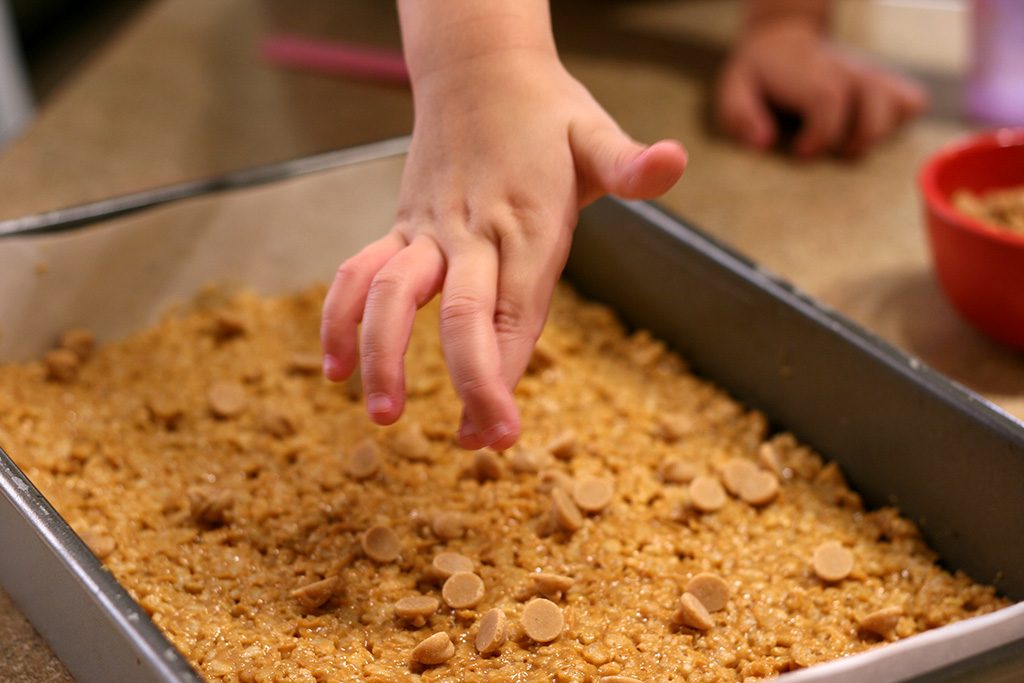 Adding peanut butter chips to the crispy chocolate peanut butter bars