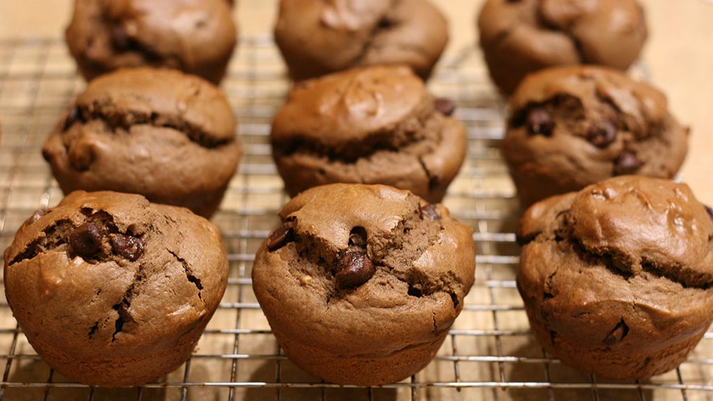 chocolate chocolate chip muffins on cooking rack