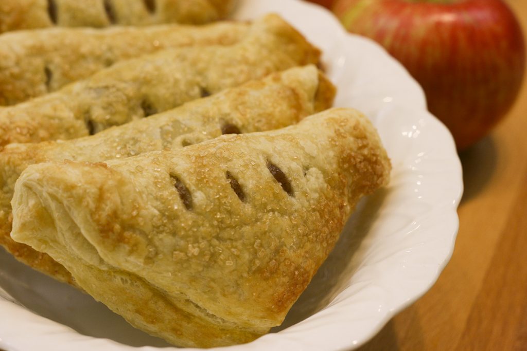 Apple Turnovers lined up in a bowl