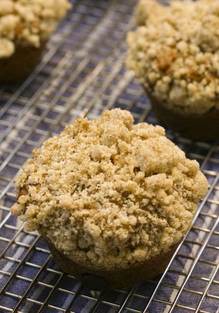 banana muffin with streusel crumb topping on a cooling rack