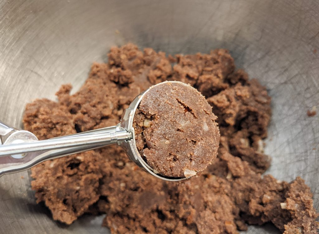 use a cookie scoop to portion the cake balls