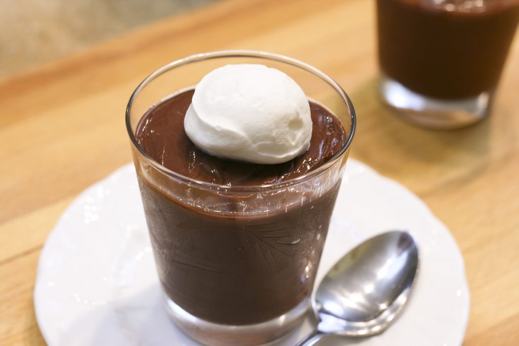 chocolate pudding in a cup with whipped cream