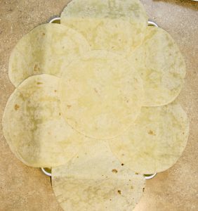 tortillas laid out on sheet pan